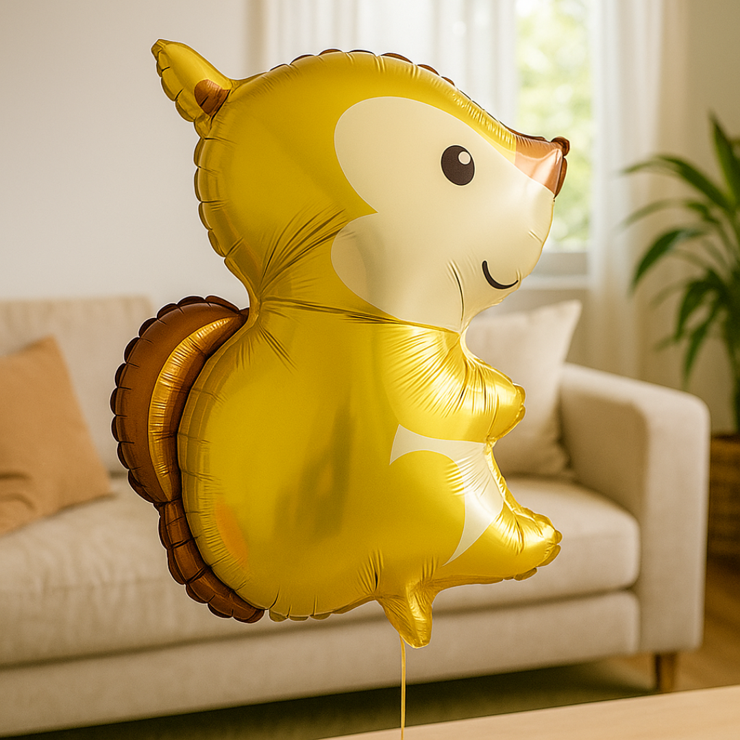 Woodland theme kids birthday party with golden squirrel foil balloon
