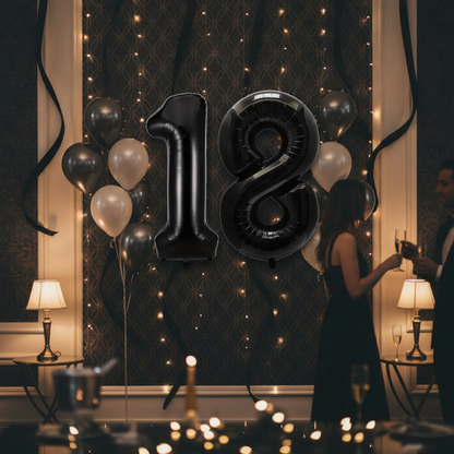 Black 18th birthday party decoration with number balloons