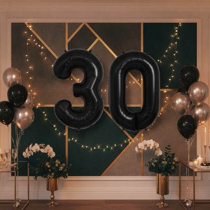 Black 30th birthday party decoration with number balloons